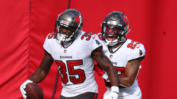 Tampa Bay Buccaneers cornerback Jamel Dean (35) celebrates a pick-six with fellow cornerback Sean Murphy-Bunting (23).